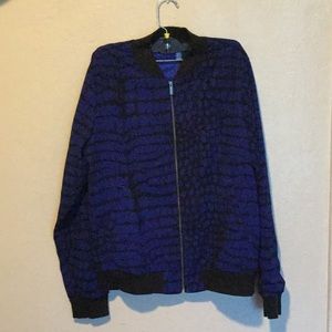 Adidas women’s tracksuit. Blue and black print.